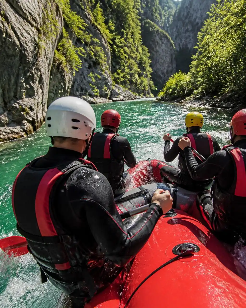 Rafters in neoprene on a raft on the Neretva canyon near Konjic